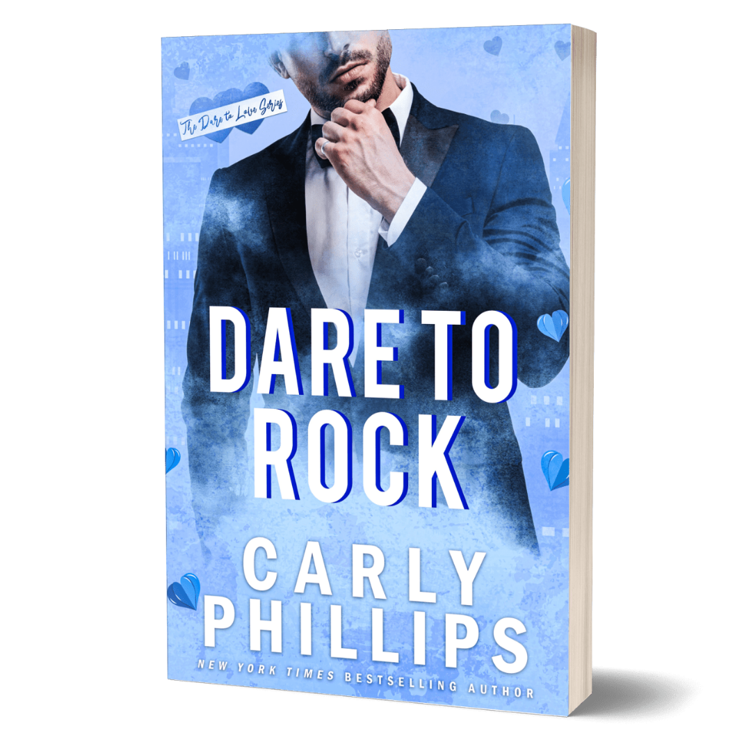 Dare to Rock paperback cover showing a blue background with a handsome hero wearing a tuxedo.