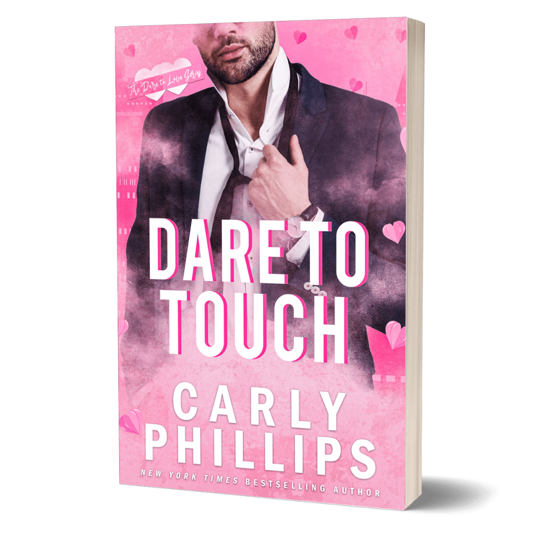 Dare to Touch paperback cover showing pink background with a handsome hero wearing a suit jacket and loosening his tie and shirt collar.
