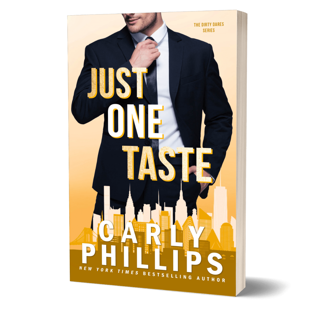 Book cover of 'Just One Taste' by Carly Phillips with a handsome man in a suit on a gold background with cityscape.